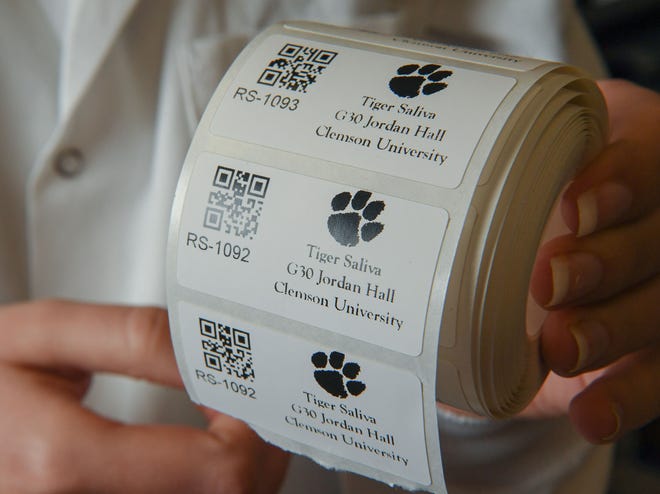 Lab stickers with a Tiger paw at the COVID-19 Clinical Diagnostics Lab at Clemson University.