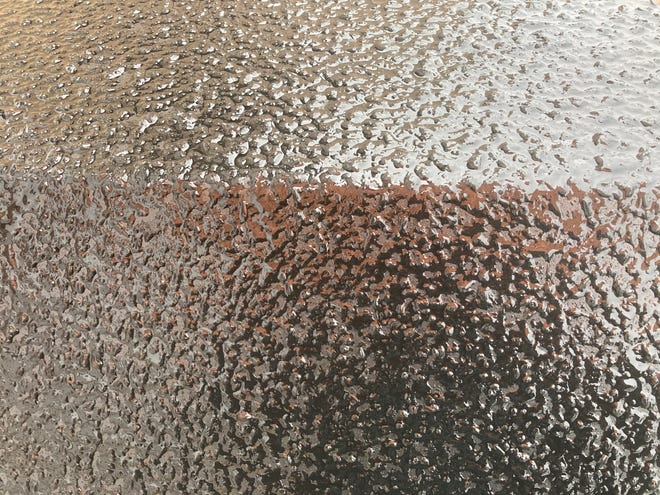 A layer of ice begins to form on surfaces in Hattiesburg, Miss., on Monday, Feb. 15, 2021.