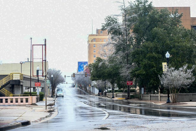 The usually busy streets of downtown are empty as wintry weather hits Hattiesburg, Miss., Monday, Feb. 15, 2021.