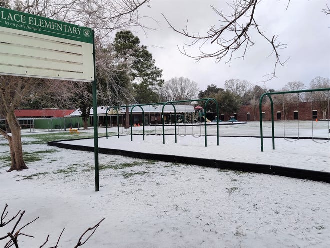Snow and ice blankets the neighborhood around Myrtle Place Elementary School in Lafayette Monday morning, Feb. 15, 2021.