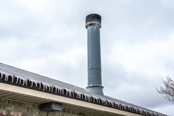 Ice on roofs and chimneys in Maurice, Louisiana Monday, Feb. 15, 2021.