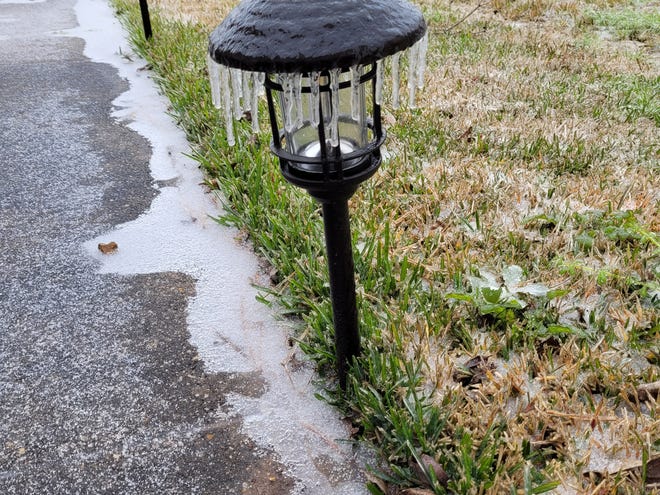 Icicles hang from a pathway light in a Lafayette neighborhood Monday Feb. 15, 2021