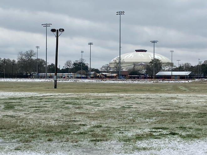 Low temperatures overnight leaves the Cajundome covered in snow and ice Monday morning, Feb. 15, 2021.