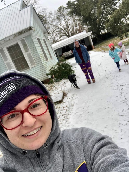 Reporter Leigh Guidry and family play in the snow at home in Crowley on Monday, Feb. 15, 2021.