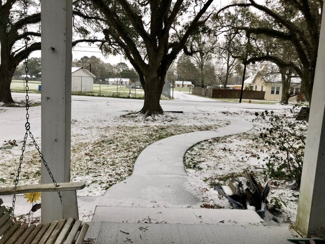 There's snow in Crowley, Louisiana, on Monday, Feb. 15, 2021.