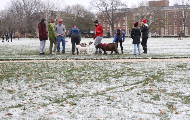 University of Alabama students enjoy the snow dusting the Quad Tuesday, Feb. 16, 2021. [Staff Photo/Gary Cosby Jr.]