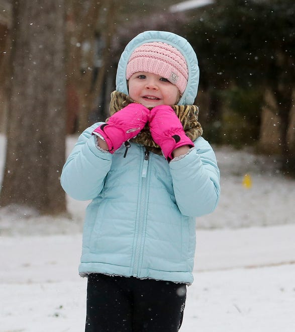 Snowfall greeted West Alabama residents Tuesday, Feb. 16, 2021. Sutton Costanzo, 4, enjoys the snow as it falls in her front yard. [Staff Photo/Gary Cosby Jr.]