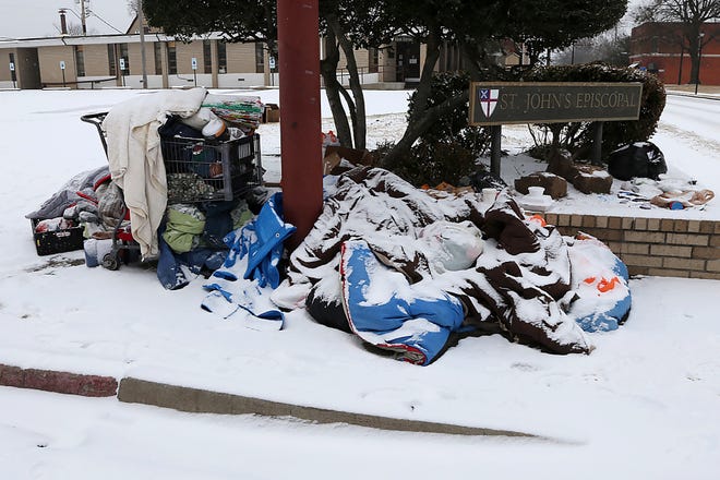 Personal belongings of the homeless are left at the corner of 6th and B in downtown Fort Smith, Wednesday, Feb. 17, 2021.